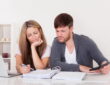 Newlywed couple having calm money talks and building financial teamwork