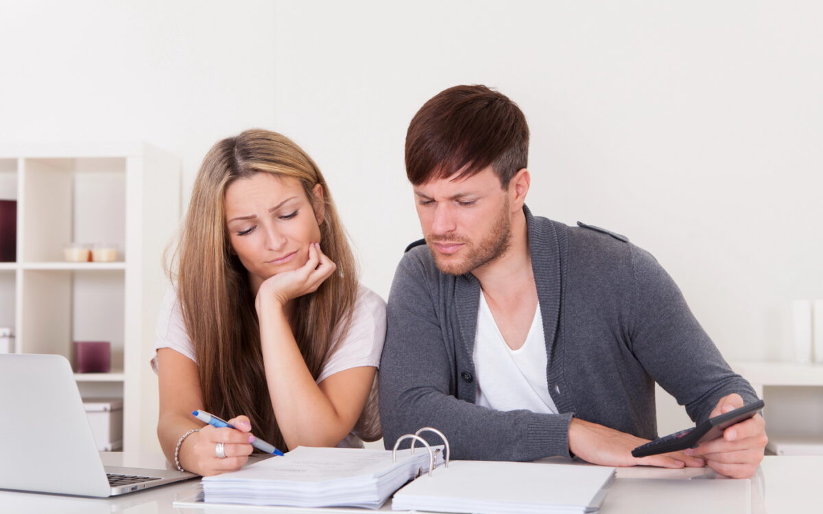 Newlywed couple having calm money talks and building financial teamwork