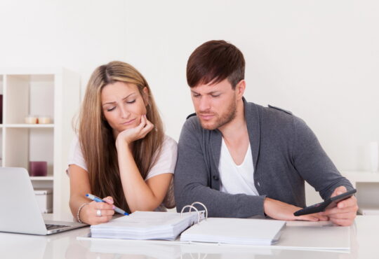 Newlywed couple having calm money talks and building financial teamwork