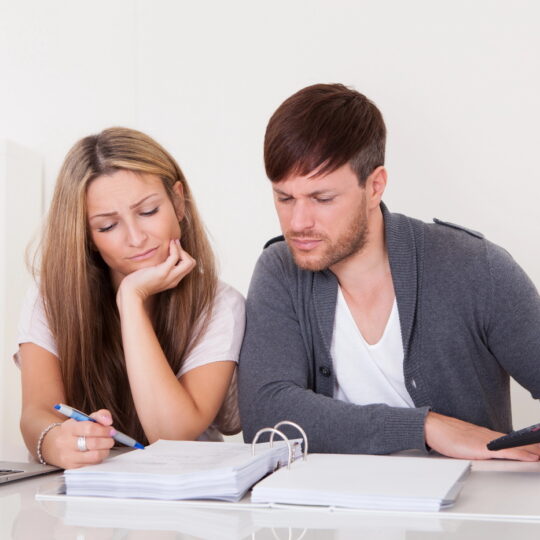 Newlywed couple having calm money talks and building financial teamwork