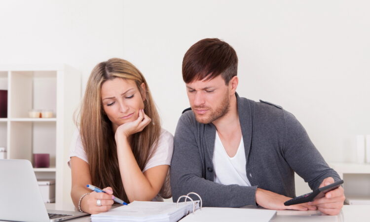 Newlywed couple having calm money talks and building financial teamwork